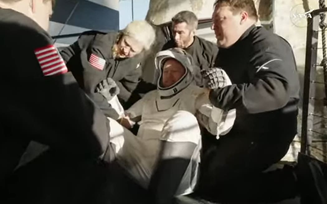 Butch Wilmore is wheeled out of the SpaceX pod and onto the recovery vessel