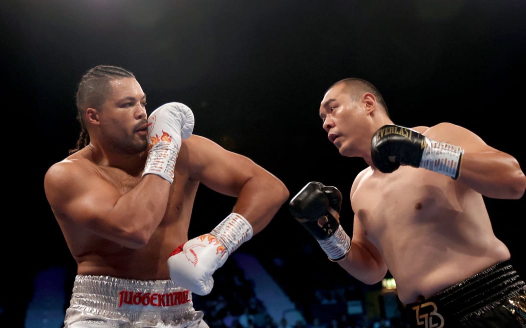 Zhang Zhilei (R) of China on his way to beating Joe Joyce of Britain in their WBO heavyweight interim title boxing rematch in London, 2023.