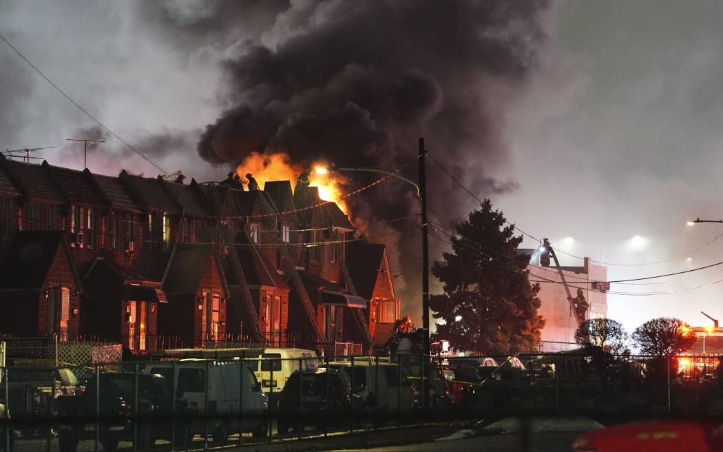 First responders work the scene after a plane crash in Philadelphia, on Friday.