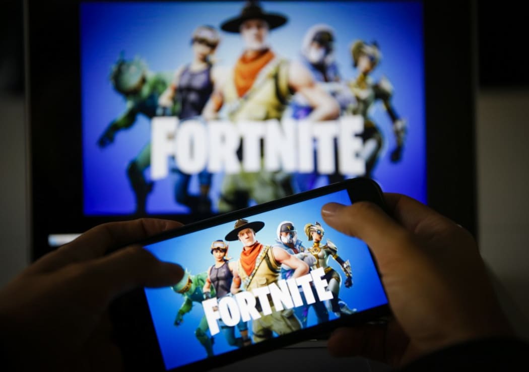 A man plays Fortnite game on smartphone in Ankara, Turkey on November 26, 2018. 
 Metin Aktas / Anadolu Agency