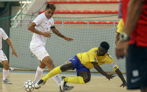 Solomon Island's captain Elliot Ragomo is brought down by Tahiti's Steeve Wong. OFC Futsal Nations Cup 2019