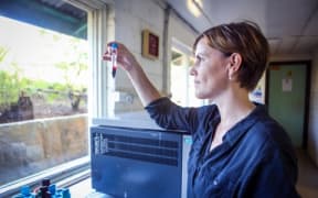 Dr Leanne Robinson with a blood sample in the Papua New Guinea Institute of Medical Research laboratory in Madang, Papua New Guinea.