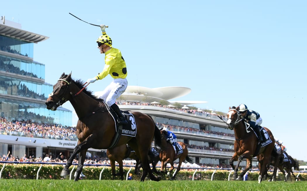MELBOURNE, AUSTRALIA - NOVEMBER 07: Mark Zahra riding Without a Fight wins the Lexus Melbourne Cup during Melbourne Cup Day at Flemington Racecourse on November 07, 2023 in Melbourne, Australia. (Photo by Quinn Rooney/Getty Images)
