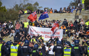 Hundreds of anti-lockdown protesters clashed with police in Melbourne, leaving at least four people injured and more than 200 arrested.