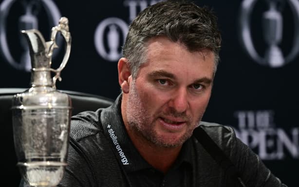 New Zealand’s Ryan Fox speaks as he holds a press conference beside the Claret Jug after winning the Open Golf championship at Royal Birkdale, England, July 19, 2026. (Photo by Ben STANSALL / AFP) / RESTRICTED TO EDITORIAL USE