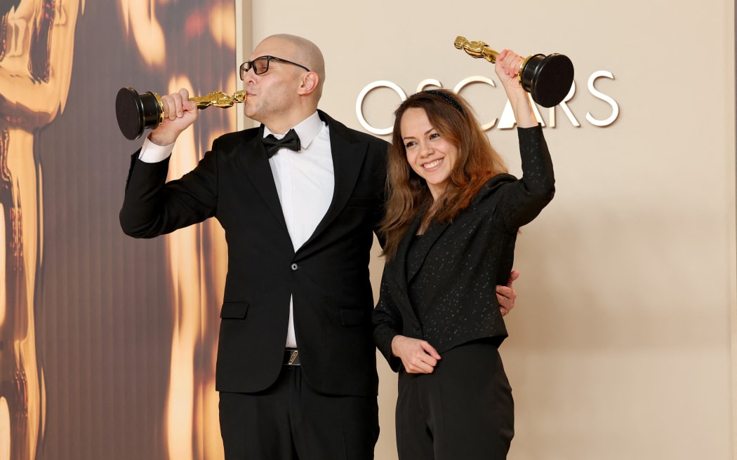 HOLLYWOOD, CALIFORNIA - MARCH 02: (L-R) Hossein Molayemi and Shirin Sohani, winners of the Best Animated Short Film award for “In the Shadow of the Cypress”, pose in the press room during the 97th Annual Oscars at Ovation Hollywood on March 02, 2025 in Hollywood, California.   Maya Dehlin Spach/Getty Images/AFP (Photo by Maya Dehlin Spach / GETTY IMAGES NORTH AMERICA / Getty Images via AFP)