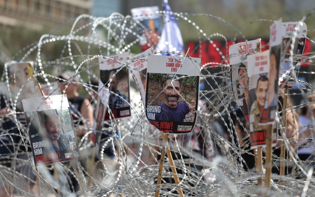 Pictures of Israeli hostages held in Gaza during a demonstration outside the Kirya military headquarters in Tel Aviv, Israel, on 2 August.