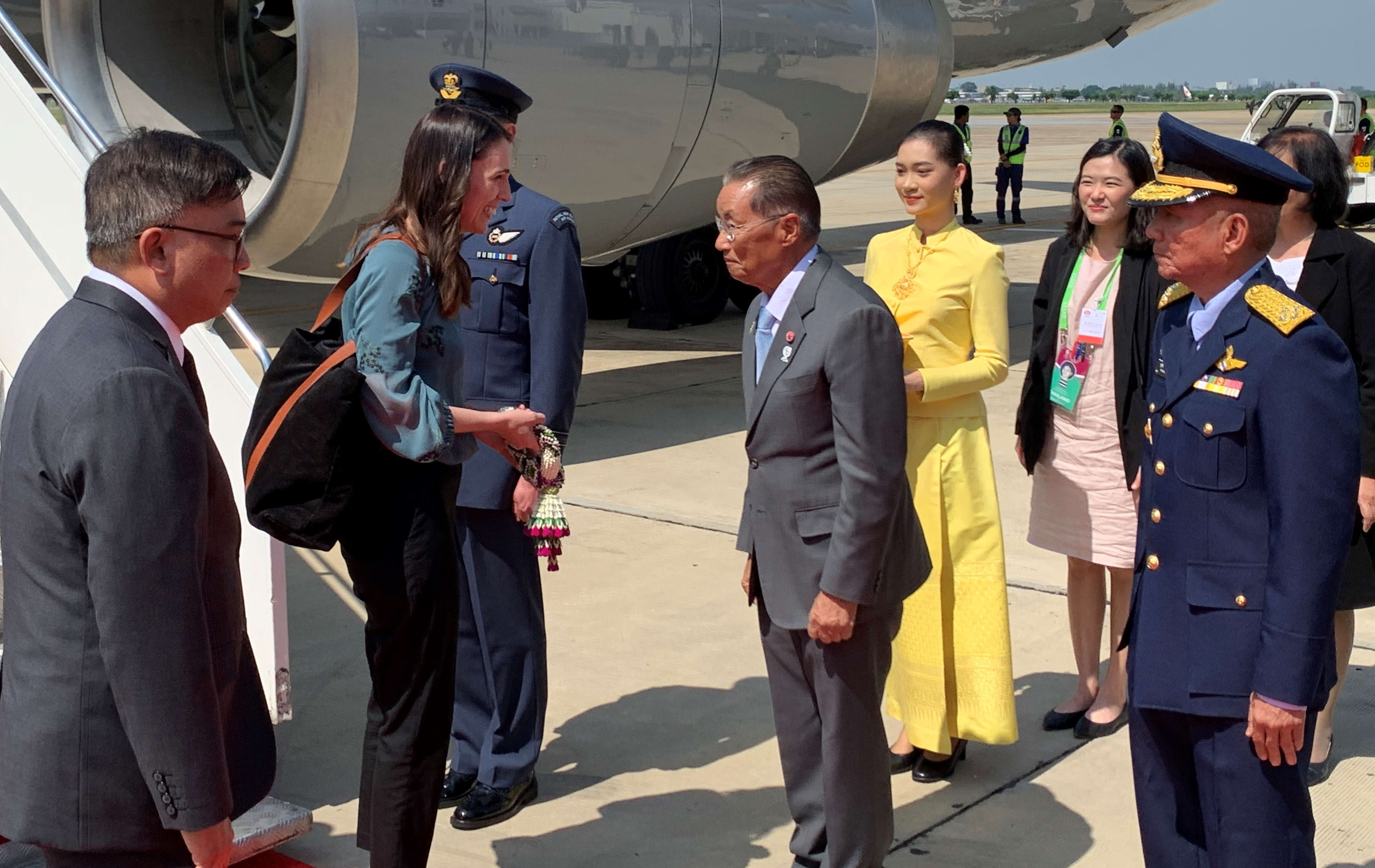 Prime Minister Jacinda Ardern is greeted by Thai's Minister of Labour, M.R. Chatu Mongol Sonakul, upon arrival to Bangkok for the East Asian Summit.