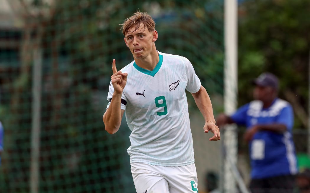 New Zealand's Ben Waine scores and celebrates his goal.