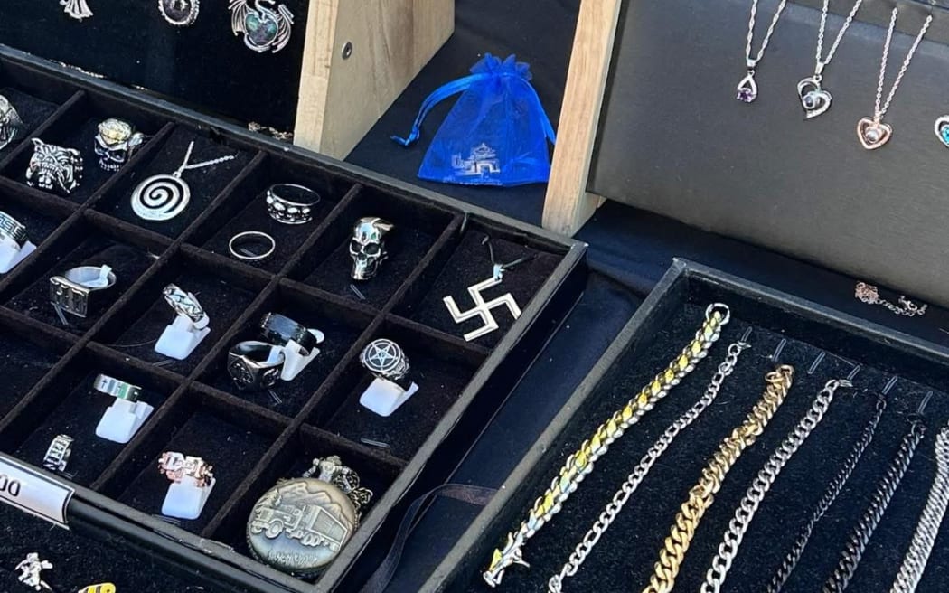 A swastika pendant displayed at a stall at Wellington's Newtown Festival.