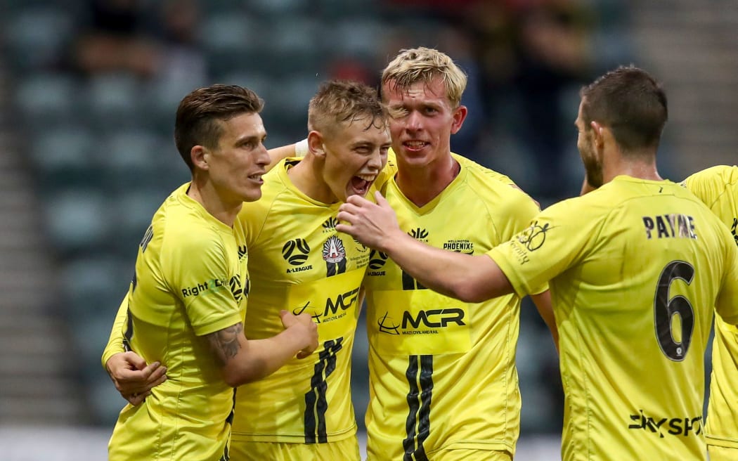 Ben Waine of the Phoenix celebrates with teammates after scoring during the A-League match,  Wellington Phoenix v Adelaide United at WIN Stadium, Sunday 25th April 2021.