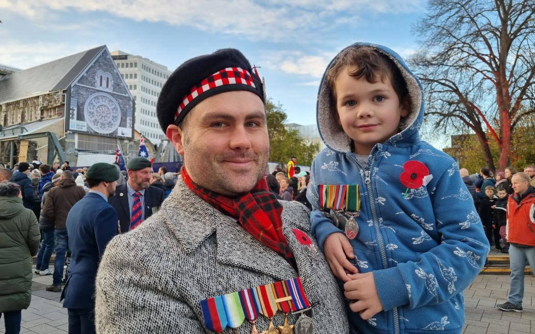 Cameron Taylor, pictured with his 5-year-old son Julian, was happy to be back commemorating Anzac Day at Christchurch Cathedral Square.