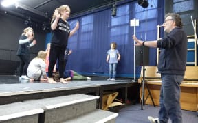 Theatre director Mike Friend taking students through their paces.
