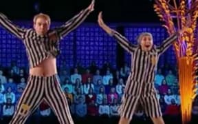 Tatiana Navka and Andrei Burkovsky perform a holocaust-themed ice skating routine.