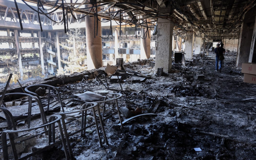 This picture shows the heavily damaged building of the Islamic Republic of Iran Broadcasting (IRIB) after it was hit a few days earlier in an Israeli strike, in Tehran, on June 19, 2025. Iran's deputy foreign minister warned the United States on June 19 against intervening in the war to back up its ally Israel, adding that his country was ready to defend itself in case of escalation. (Photo by AFP)