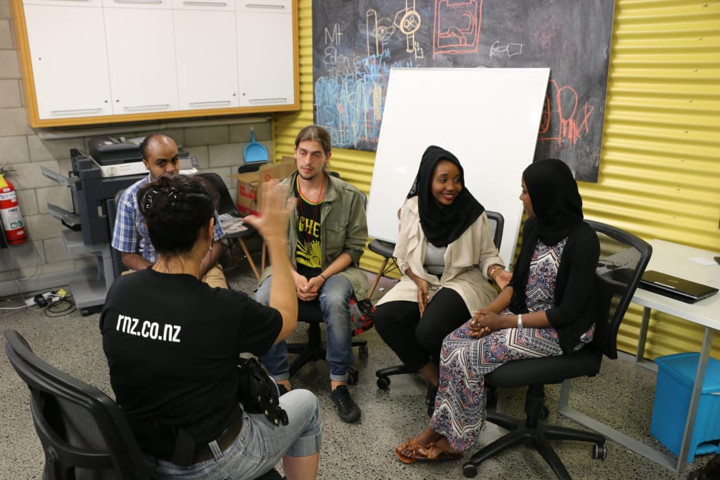 Members of the African Youth Forum discuss repercussions after the report