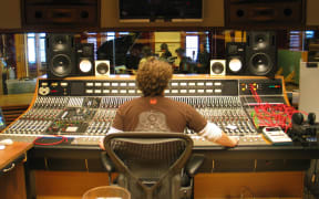This is a photo taken over the engineers shoulder as Crowded House perform on NZ Live.