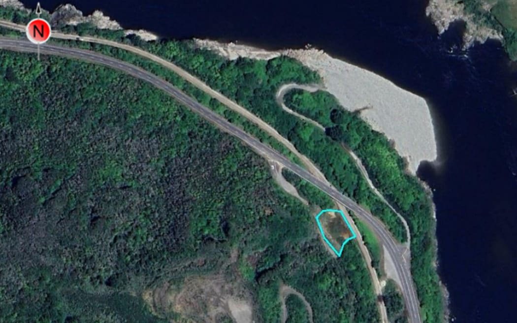An aerial view of the Kiwi Point Quarry in 2020 when most quarry activities appeared to have ceased. The Kiwi Point rail overbridge, the railway and state highway into Greymouth can be seen between the quarry and the Grey River.