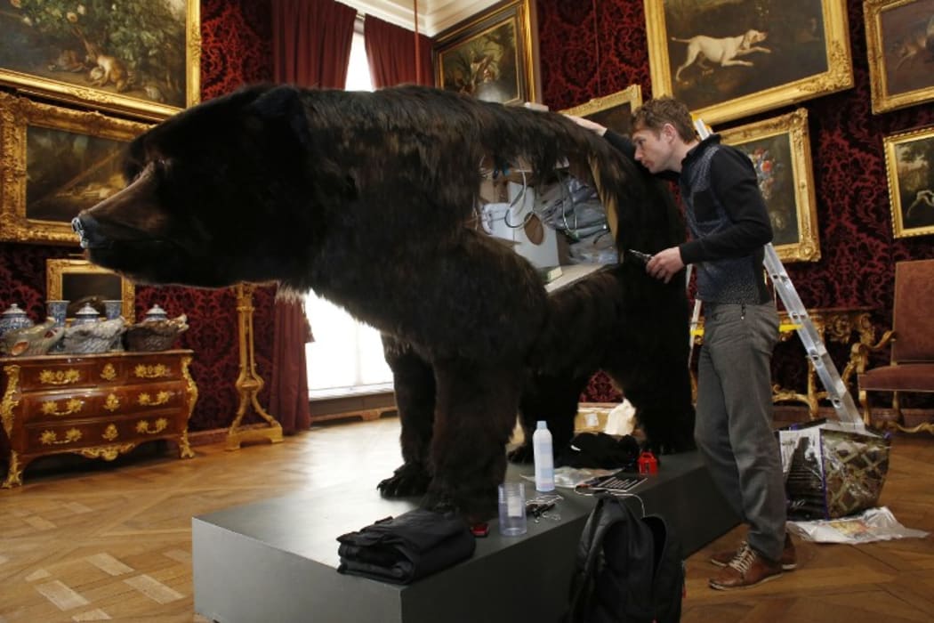 French artist Abraham Poincheval and the hollowed-out bear he lived in.