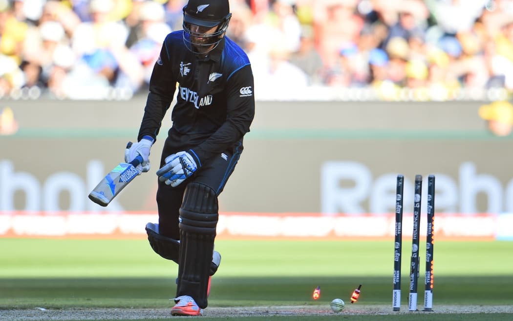 New Zealand batsman Daniel Vettori is bowled by Australia's fast bowler Mitchell Johnson.