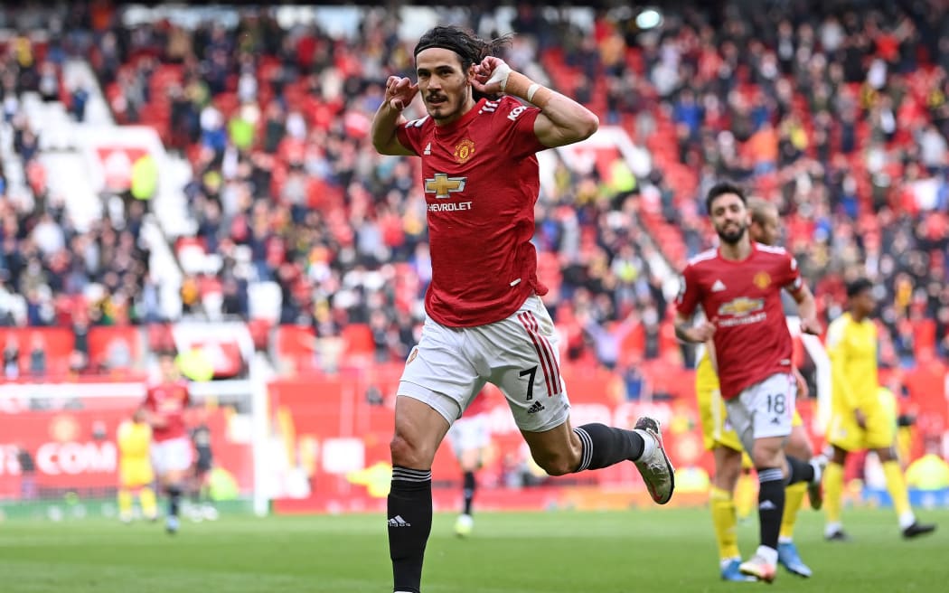 Manchester United's Uruguayan striker Edinson Cavani celebrates scoring the opening goal during the English Premier League football match between Manchester United and Fulham at Old Trafford in Manchester, north west England, on May 18, 2021.