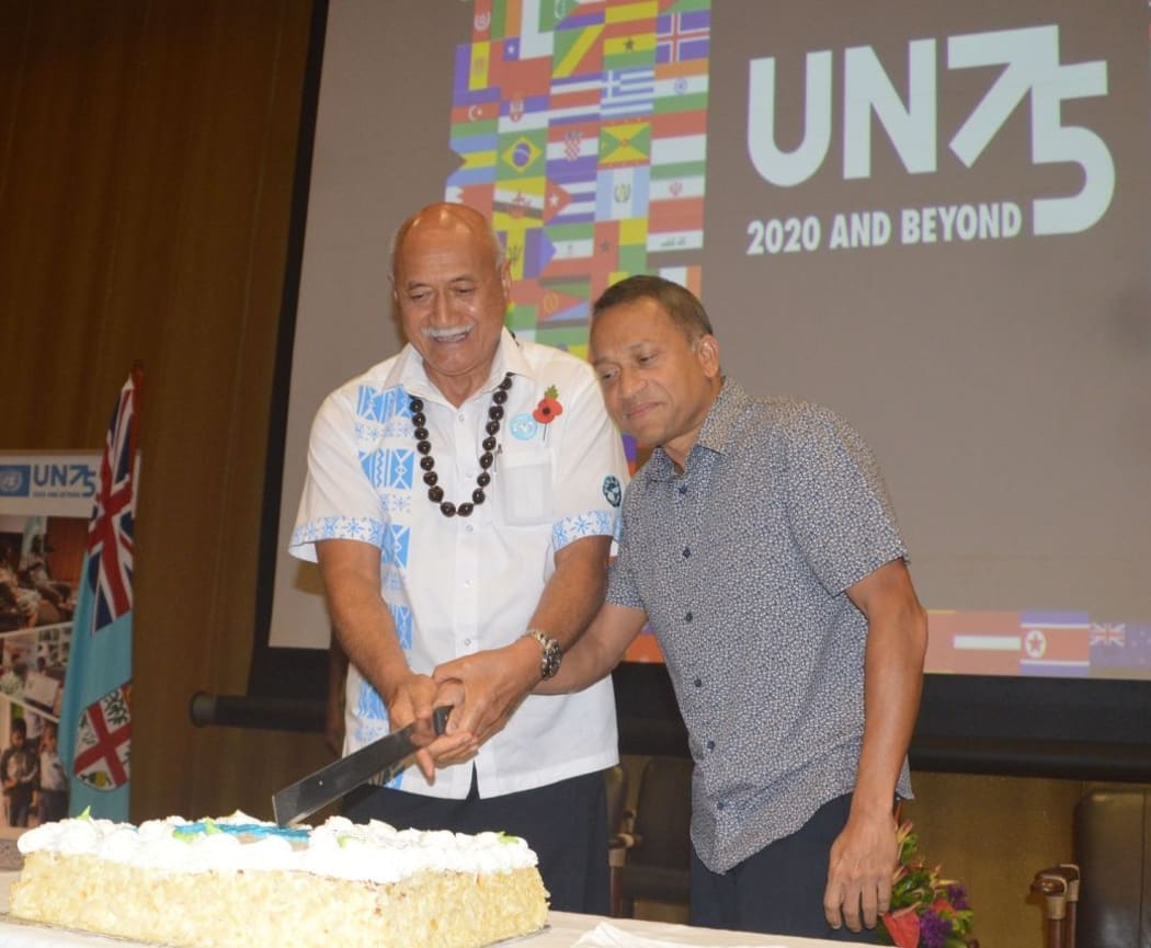 Fiji's President Jioji Konrote and the UN's Pacific Coordinator Sanaka Samarasinha mark the UN's 75th anniversary in Suva last weekend.