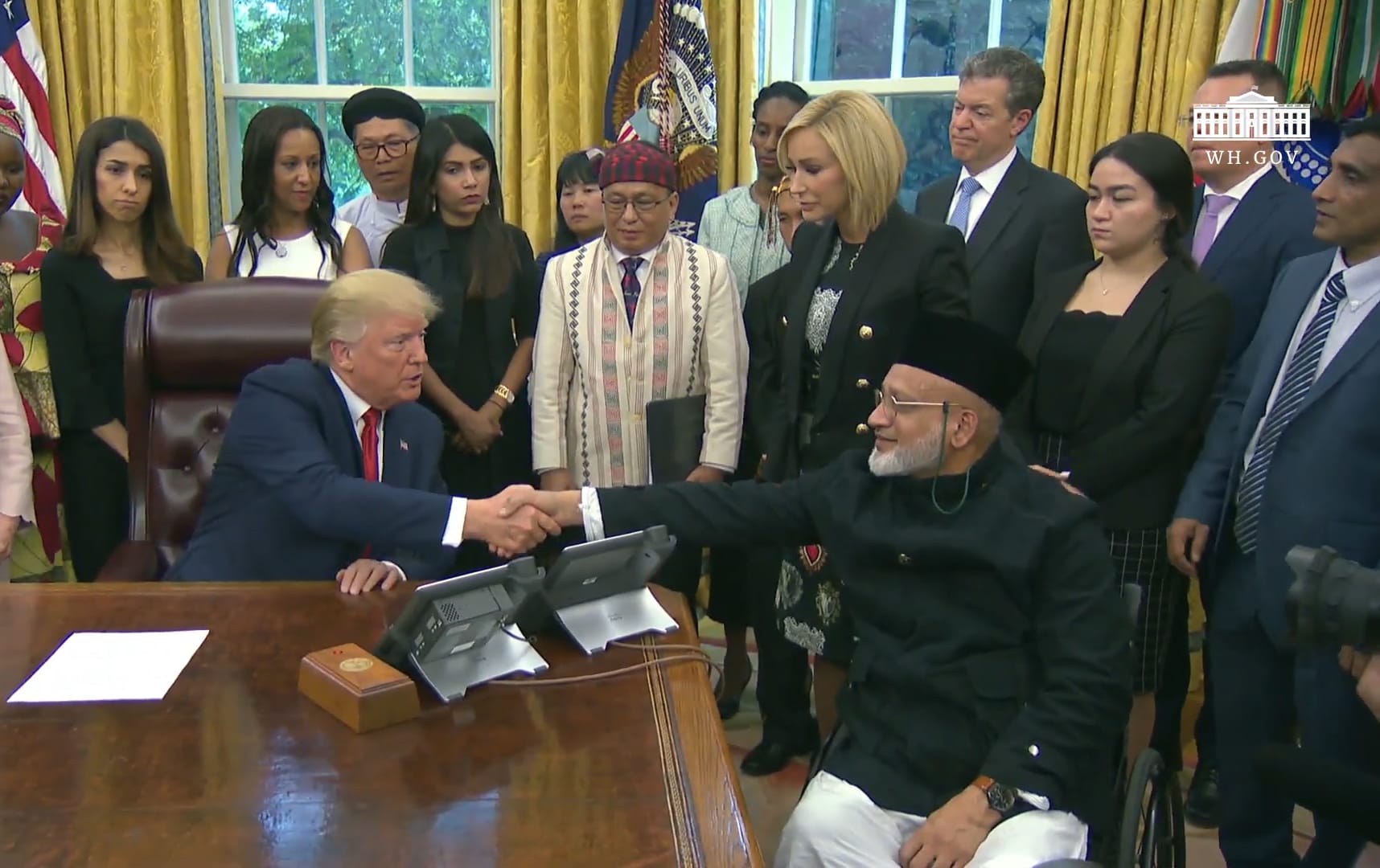 US President Donald Trump meeting with Christchurch mosque shooting survivor Farid Ahmed.