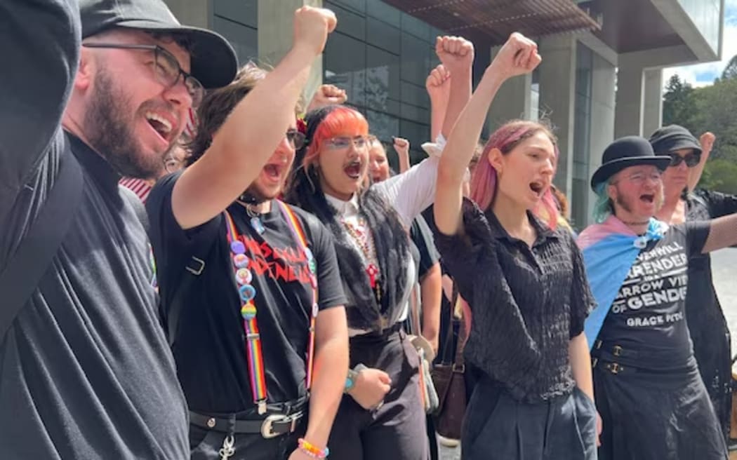 Supporters of the legal action outside court in Brisbane. (ABC News: Janelle Miles)