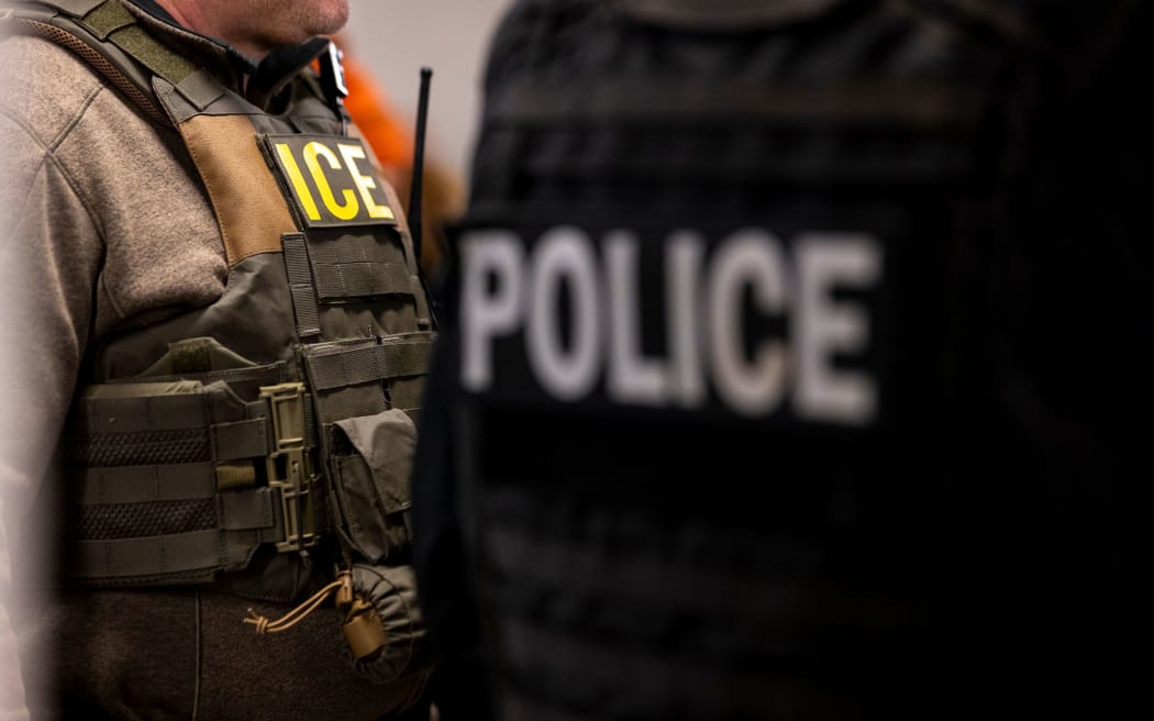 US Immigration and Customs Enforcement (ICE) agents and other federal officers attend a pre-enforcement meeting in Chicago on January 26. President Donald Trump has pledged to carry out the largest deportation effort in US history.