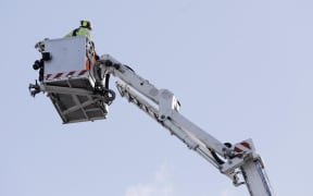 Fire investigators work at the scene following a fatal fire at Loafers Lodge in Wellington on 16 May, 2023.