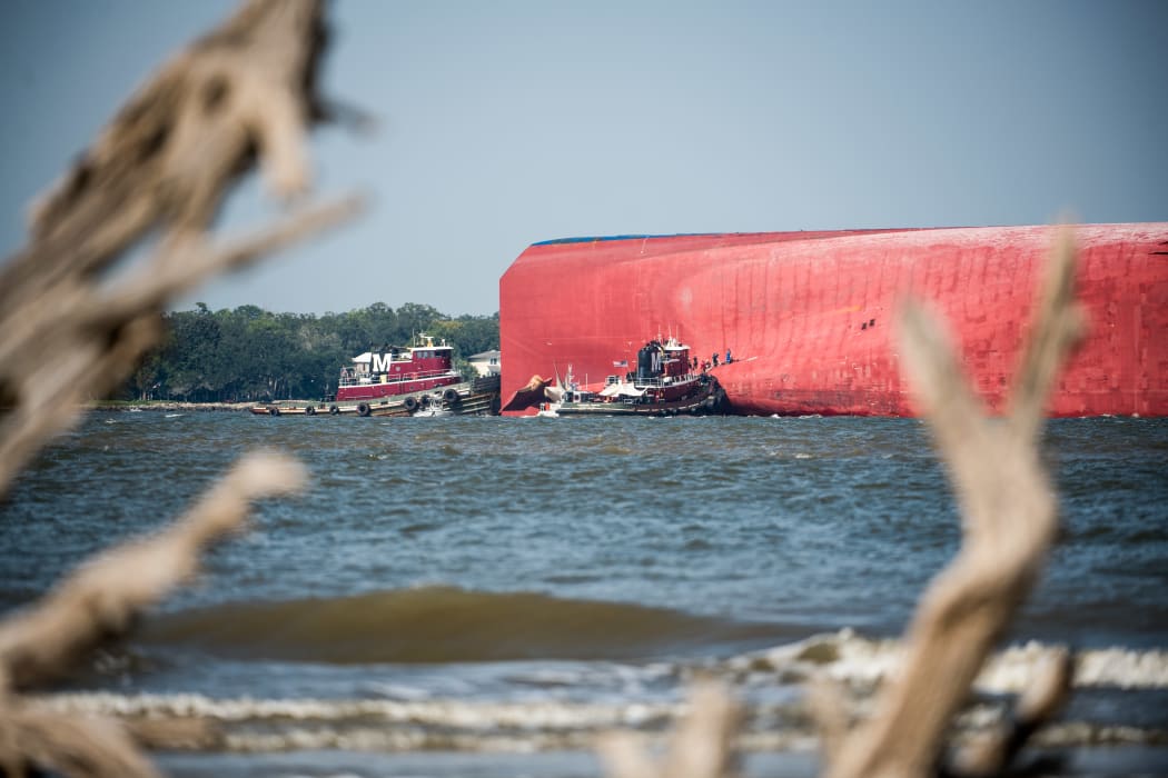 Emergency responders work to rescue crew members from a capsized cargo ship on September 9, 2019 in St Simons Island, Georgia.