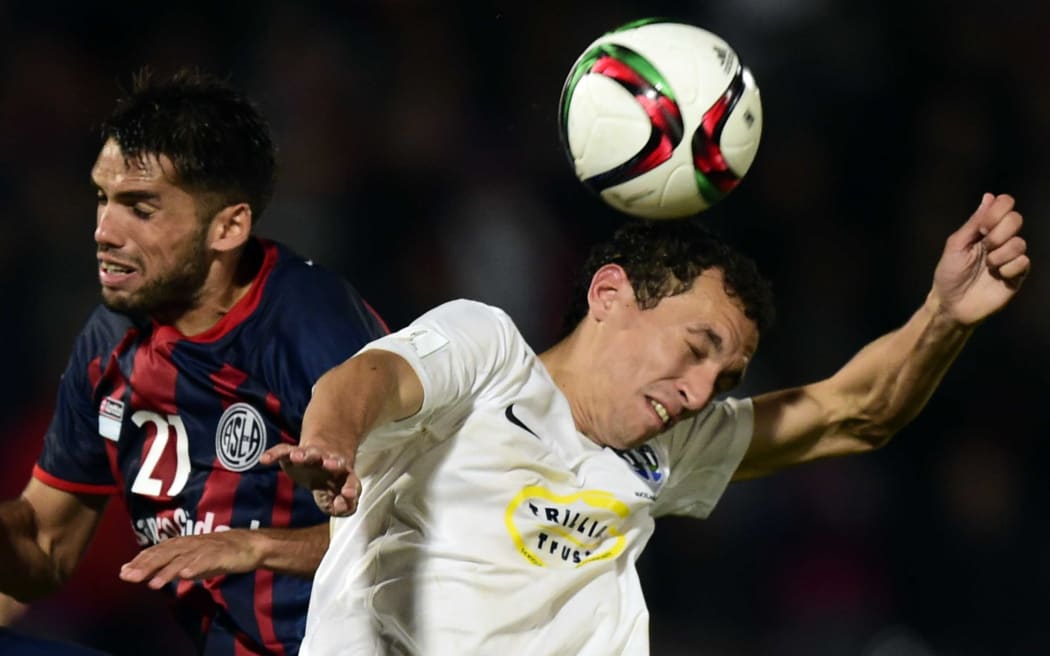 Auckland City's Spanish defender Angel Berlanga (R) vies with San Lorenzo's defender Emmanuel Mas during the FIFA Club World Cup semifinal football match between San Lorenzo vs Auckland City FC at the Marrakesh stadium in Marrakesh on