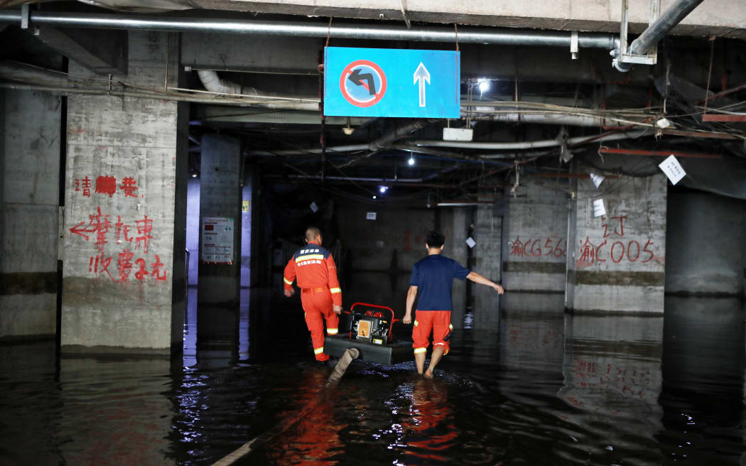 Rescue workers are conducting drainage operations in a store in Chongqing, China on 9 July, 2025.