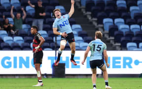 Will Harrison of the Waratahs celebrates kicking the winning field goal in golden point during the round eight Super Rugby Pacific match between NSW Waratahs and Crusaders.