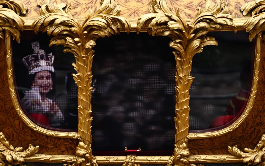 A hologram of Britain's Queen Elizabeth II is projected on the Gold State Coach during the Platinum Pageant in London on 5 June 2022.