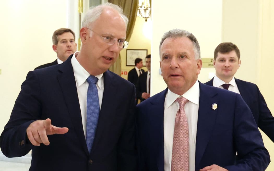 In this pool photograph distributed by the Russian state agency Sputnik, Russia's top economic negotiator Kirill Dmitriev talks to US President Donald Trump's envoy Steve Witkoff in Saint Petersburg on April 11, 2025. (Photo by Vyacheslav PROKOFYEV / POOL / AFP)