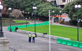 Police officers on Parliament's forecourt ahead of a planned protest on 23 August 2022.