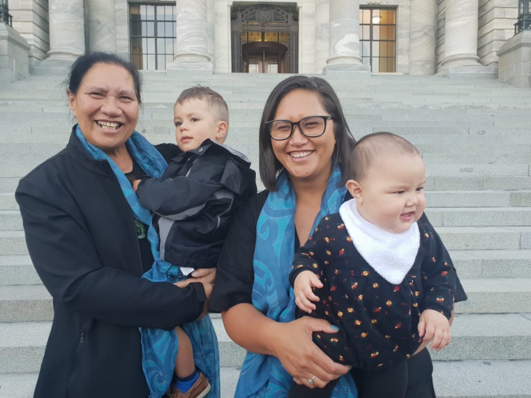 Dianna Vaimoso, at left, holding her grandson Toa, with her daughter Hinerangi Vaimoso, right.