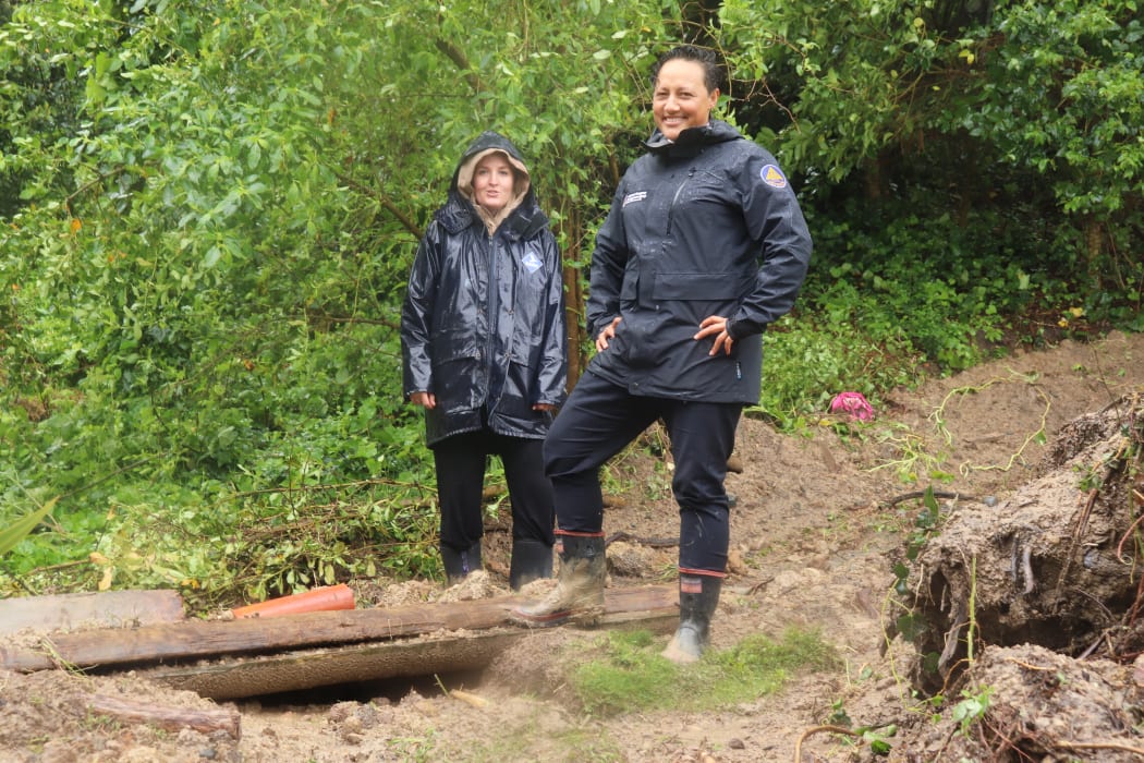 Katie Fitzpatrick (left) with Minister for Emergency Management Kiri Allan after flooding in Gisborne left the resident's property covered in mud.
