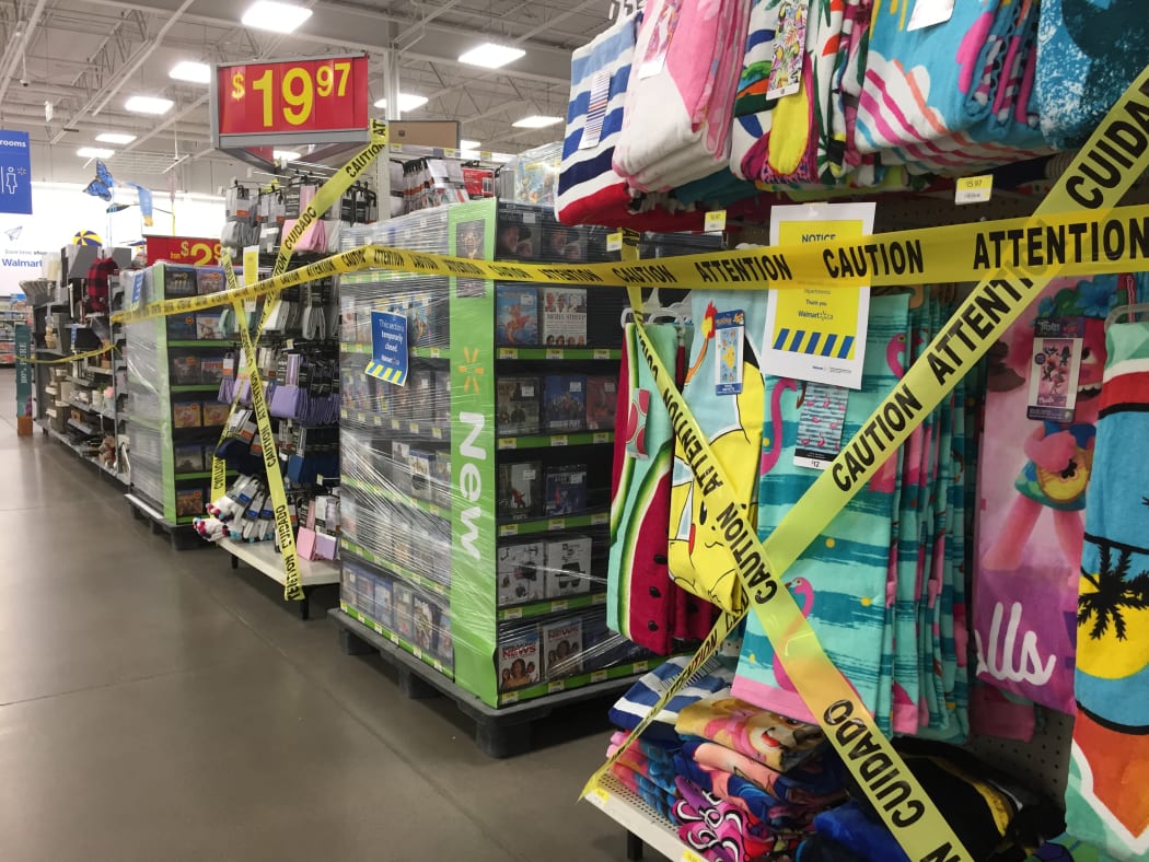 Aisles shut to customers in a Walmart in Ontario, Canada, where stores are not allowed to sell non-essential items during a stay-at-home order.