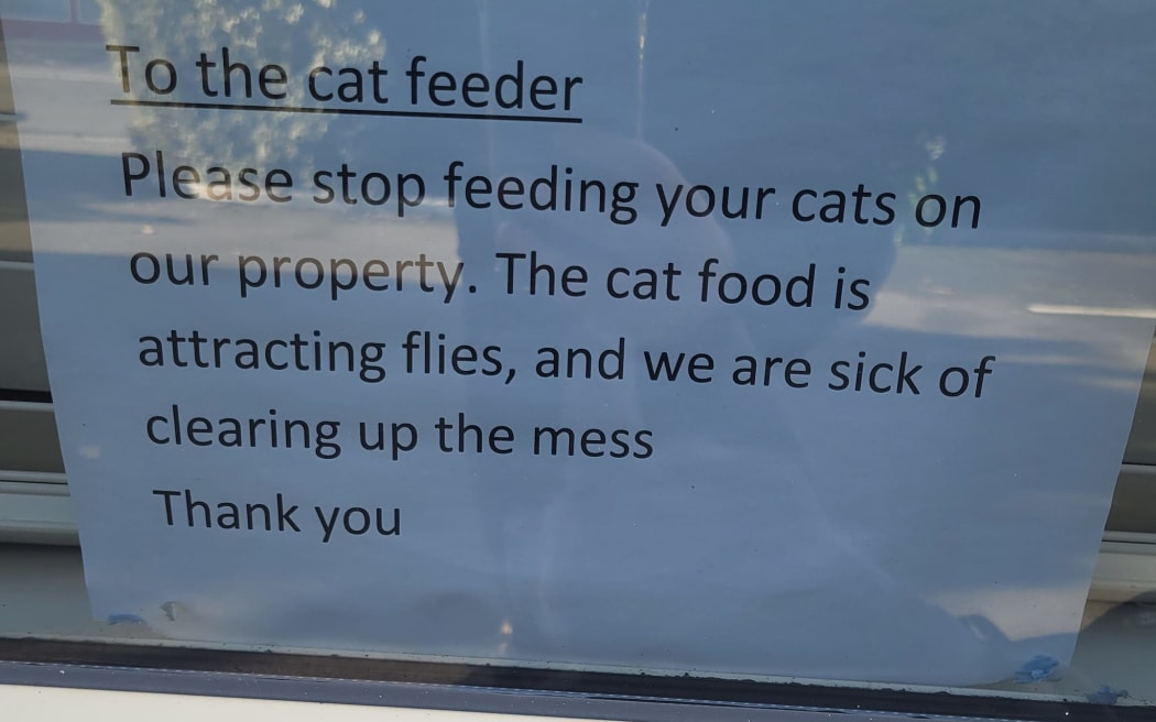 Bishopdale Medical Centre had put up a sign addressed to the cat feeder, asking them to stop feeding cats on their property because it was attracting flies and they were sick of cleaning it up.