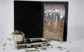 Synthetic cannabis and a pipe.