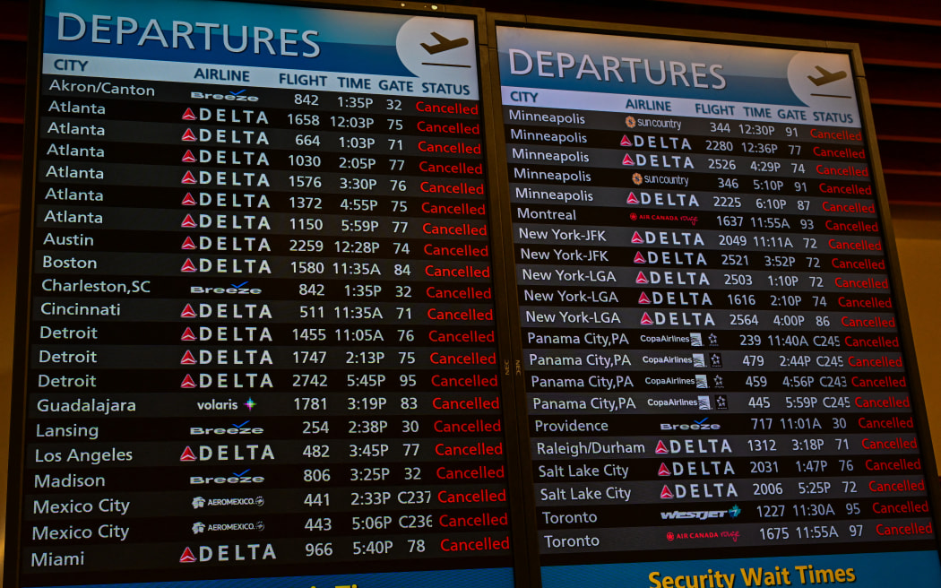 Screens showing canceled flights at Orlando International Airport, closed to commercial flights ahead of Hurricane Milton's arrival in Florida on October 9, 2024. - Milton regained power on October 8 to become a Category 5 storm with maximum sustained winds of 165 mph (270 kph) as it barrels towards the west-central coast of Florida and is forecast to make landfall late October 9, according to the National Hurricane Center. (Photo by GIORGIO VIERA / AFP)