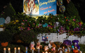 BLUE POINT, NY - SEPTEMBER 24: A sign at a roadside memorial honors the death of Gabby Petito on September 24, 2021 in Blue Point, New York.