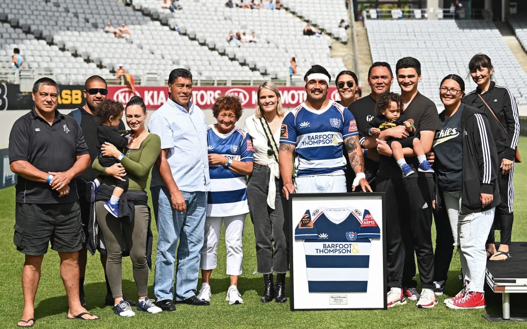 Marcel Renata is presented with a framed Auckland jersey in his 50th game. 2020.