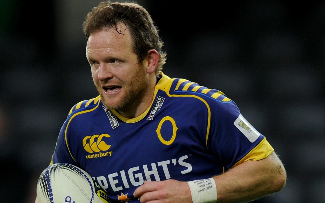 The Otago first-five Peter Breen on his way to scoring a try.