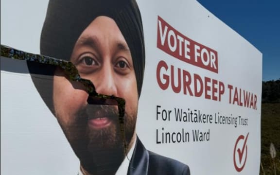 Damaged billboards of Gurdeep Talwar, contesting the Waitākere Licensing Trust’s Lincoln ward seat as an independent