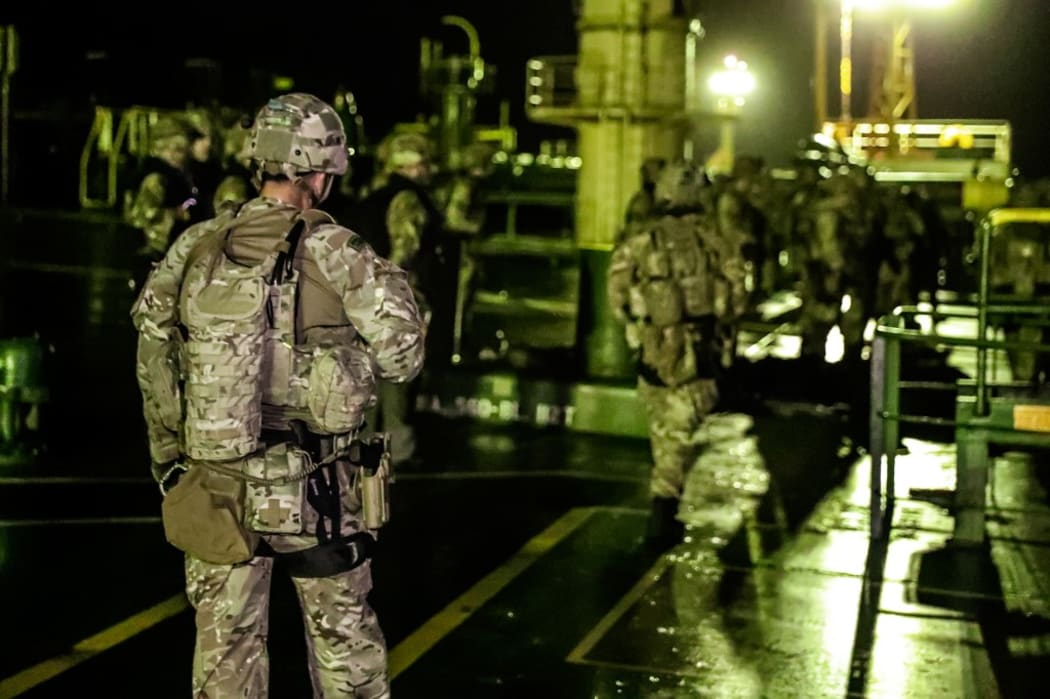 A handout picture released by the Ministry of Defence shows British Royal Marines taking part in the seizure of an Iranian oil tanker, Grace 1 in the early hours of July 4, 2019 off the Gibraltar strait.