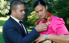 Dame Valerie Adams and her husband Gabriel Price at her investiture during the week.