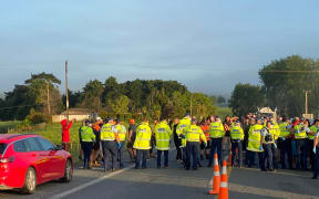 Protesters gathered at the northern side of Auckland's northern boundary on Tuesday morning.